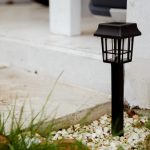 Solar-powered garden lamp in the daytime. Renewable eco energy in domestic life