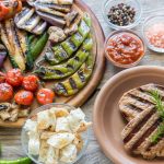 Grilled vegetables with beef steak on the wooden board